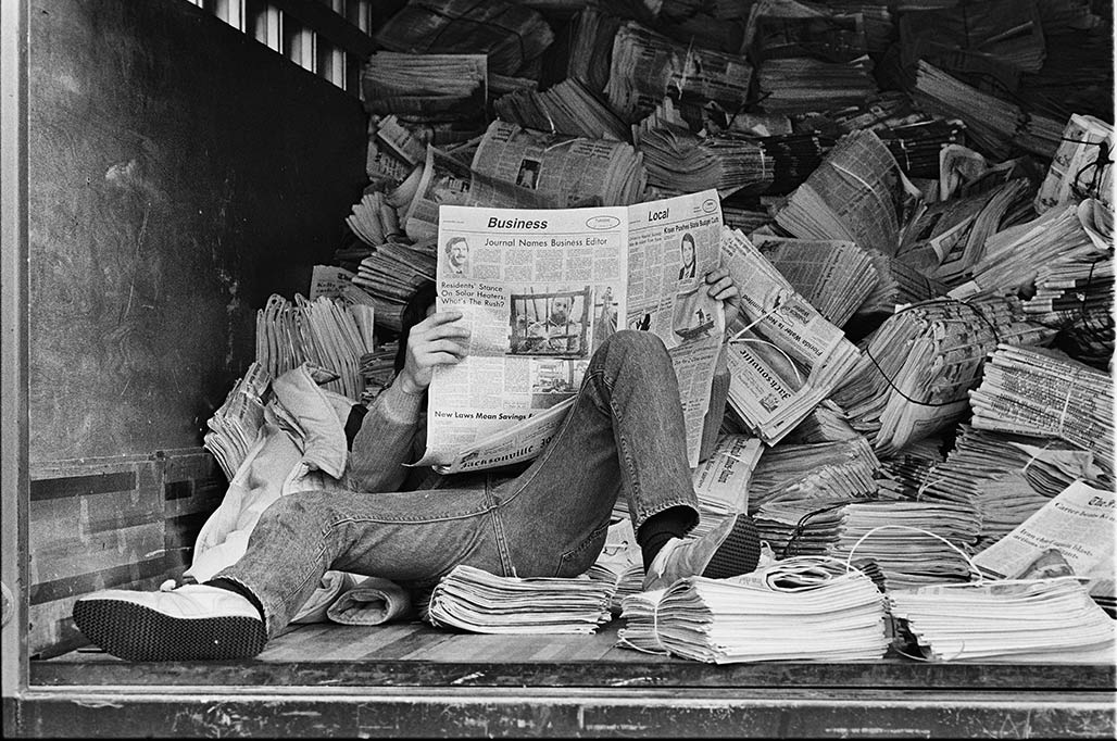 man reads newspaper