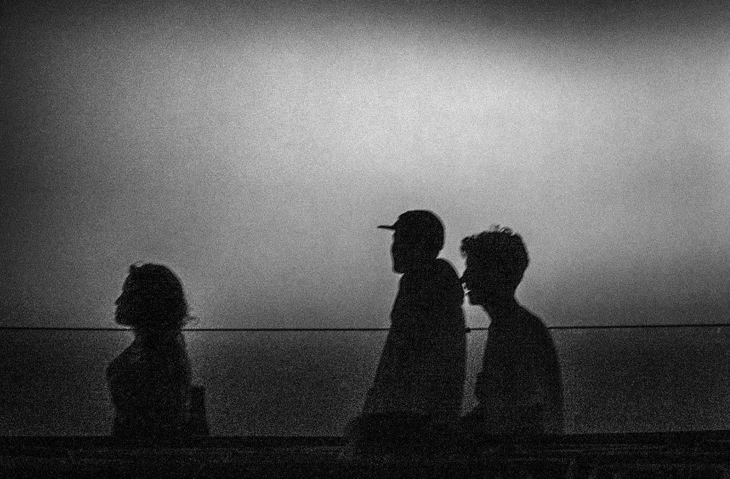 silhouettes of three people