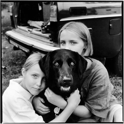 two girls and their dog