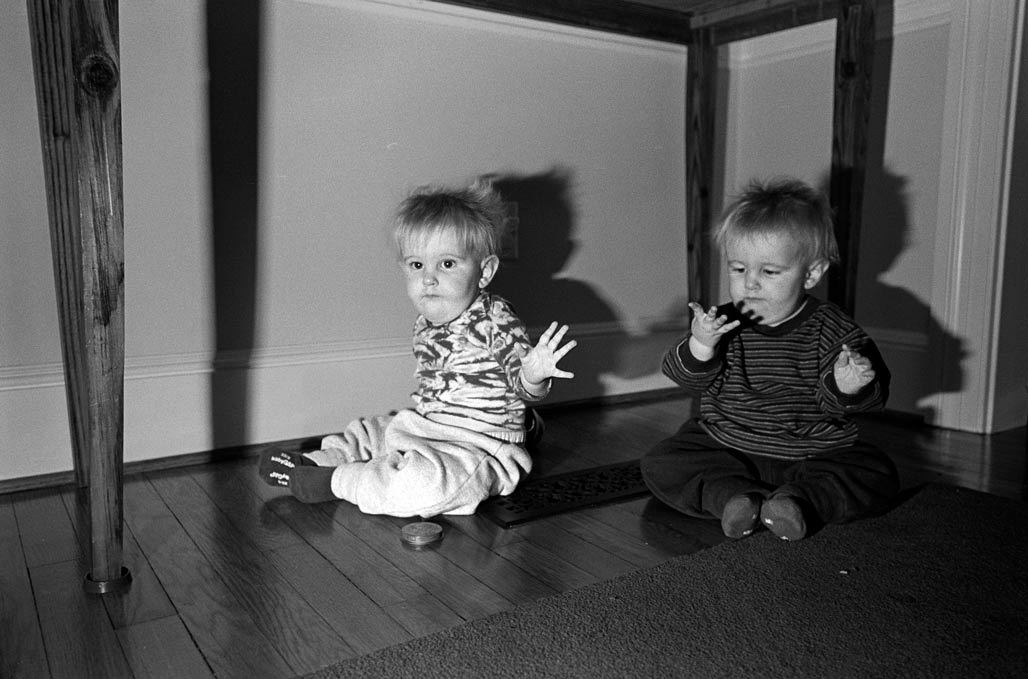 twins, looking at their hands